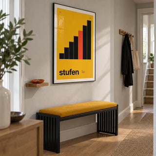 Mustard Wall Art, framed on the wall of a bright narrow hallway in a renovated UK terrace with a pale grey wall and simple oak floorboards