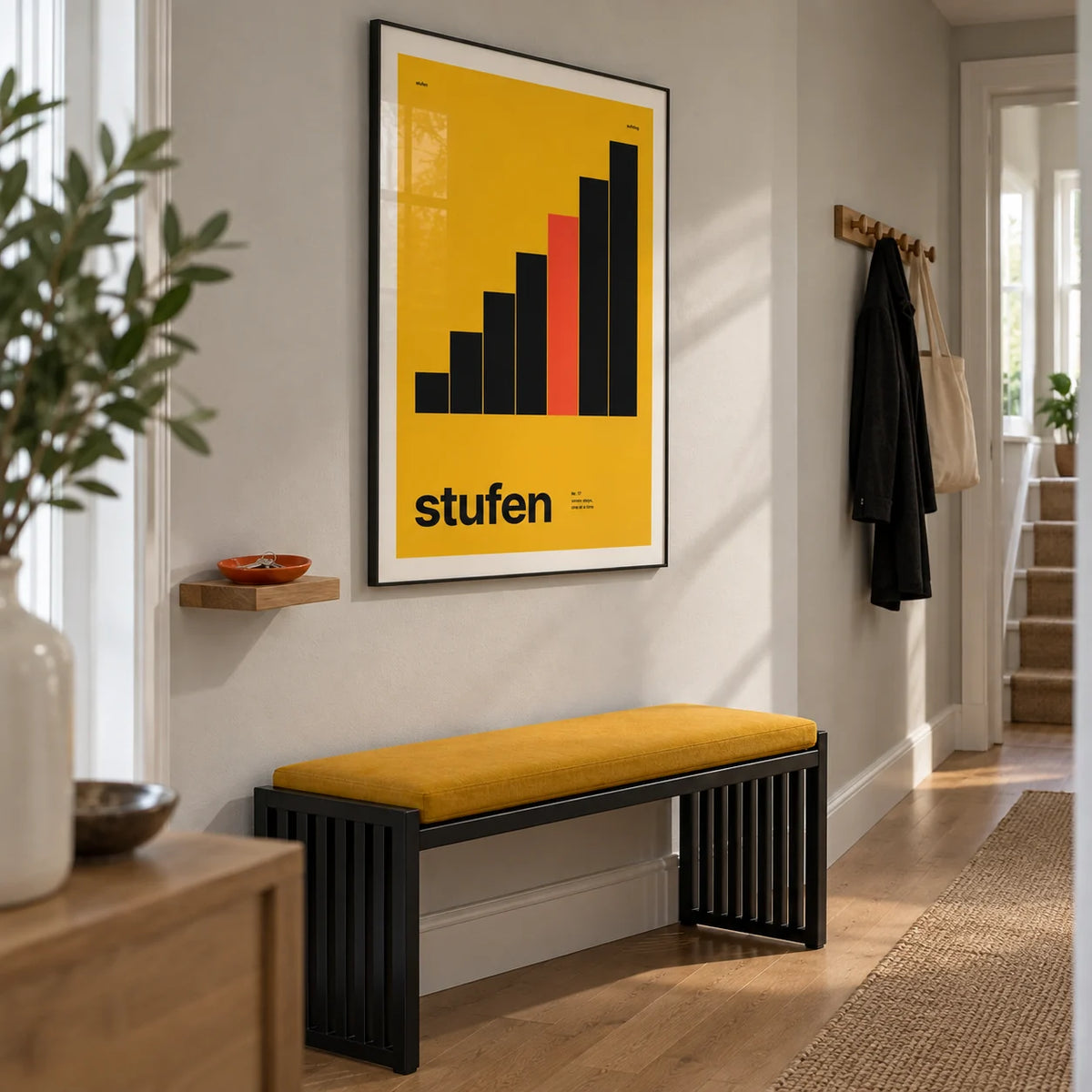 Mustard Wall Art, framed on the wall of a bright narrow hallway in a renovated UK terrace with a pale grey wall and simple oak floorboards