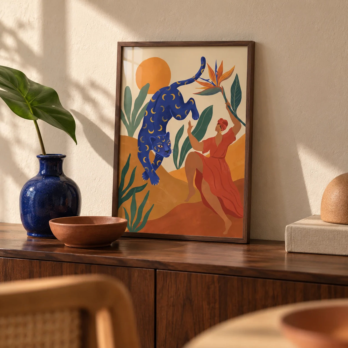 Mystical Blue Leopard Wall Art, a small A4 framed print leaning on a walnut side table in a hallway