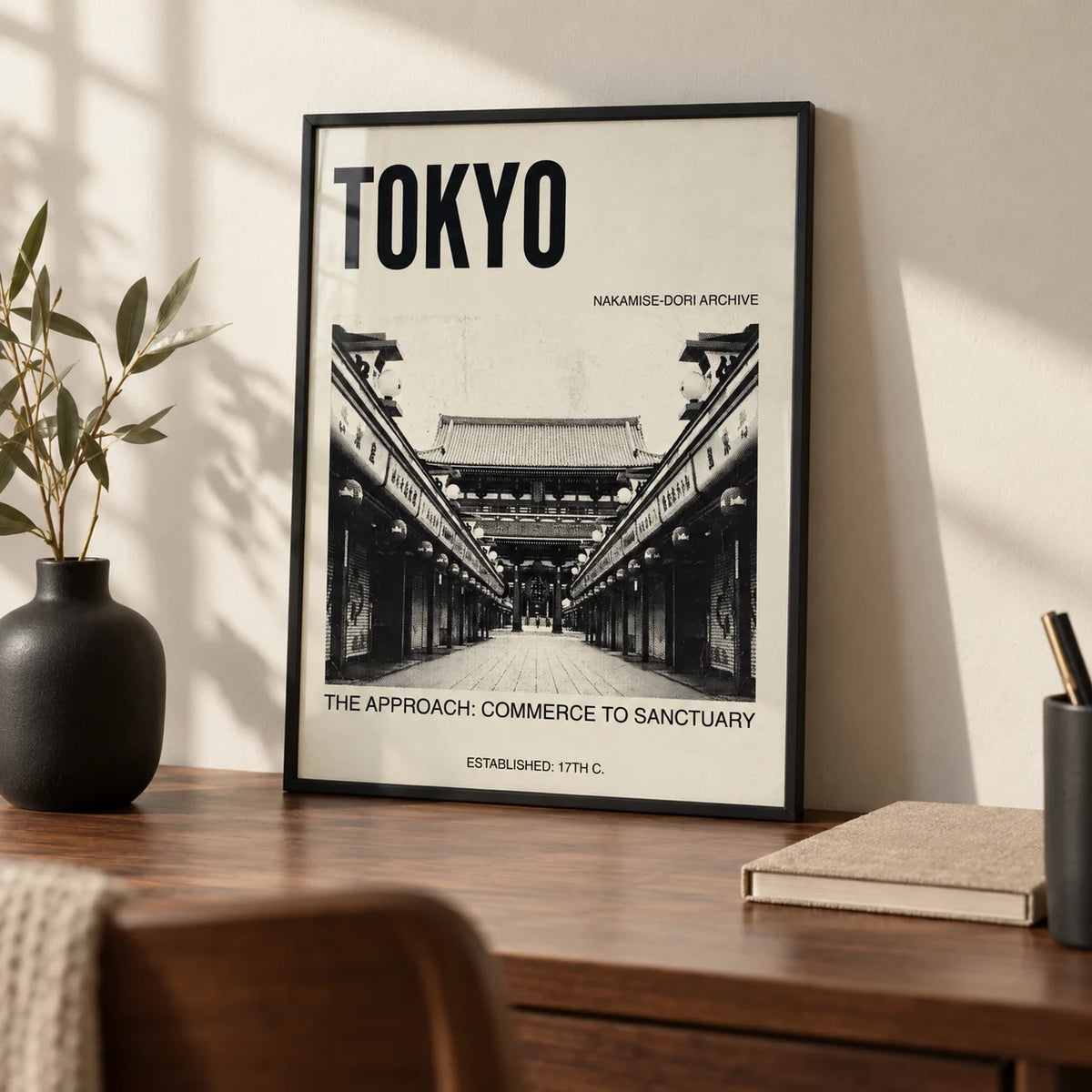 Nakamise Dori Art Print, a small A4 framed print leaning on a walnut writing desk