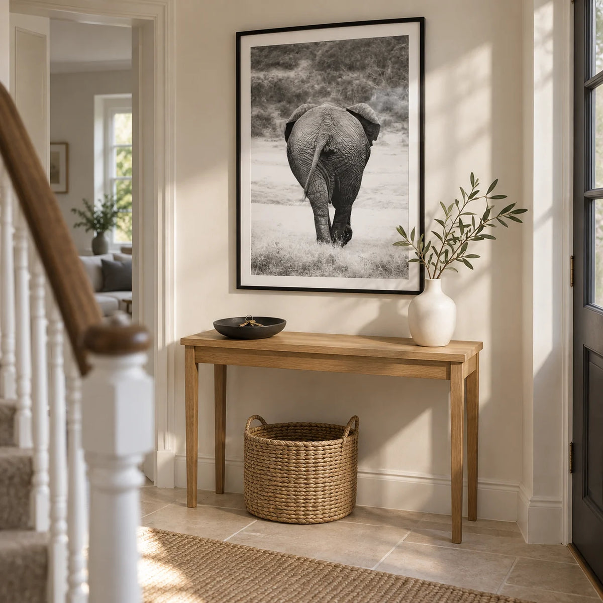 Nature Animal Wall Art, framed on the wall of a bright hallway in a renovated UK semi-detached house with off-white plaster walls and a pale stone floor