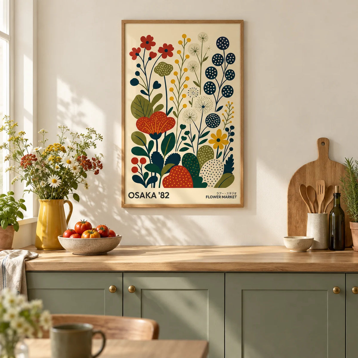 Nature Artwork, framed on the wall of a bright kitchen with plain sage green cabinets and a cream wall
