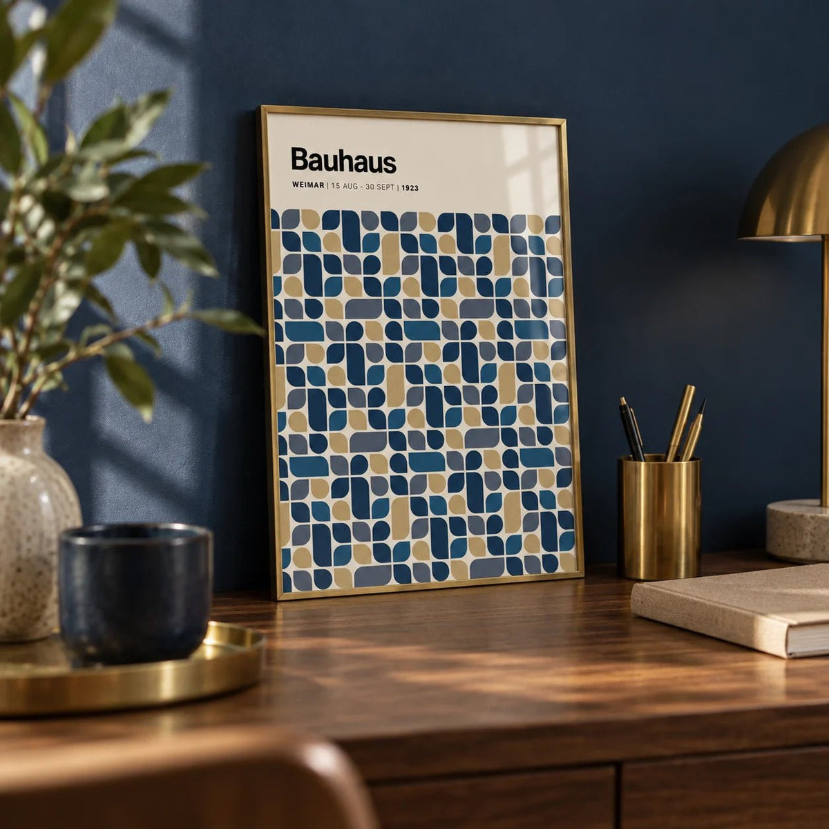 Navy and Gold Wall Art, a small A4 framed print leaning on a walnut desk