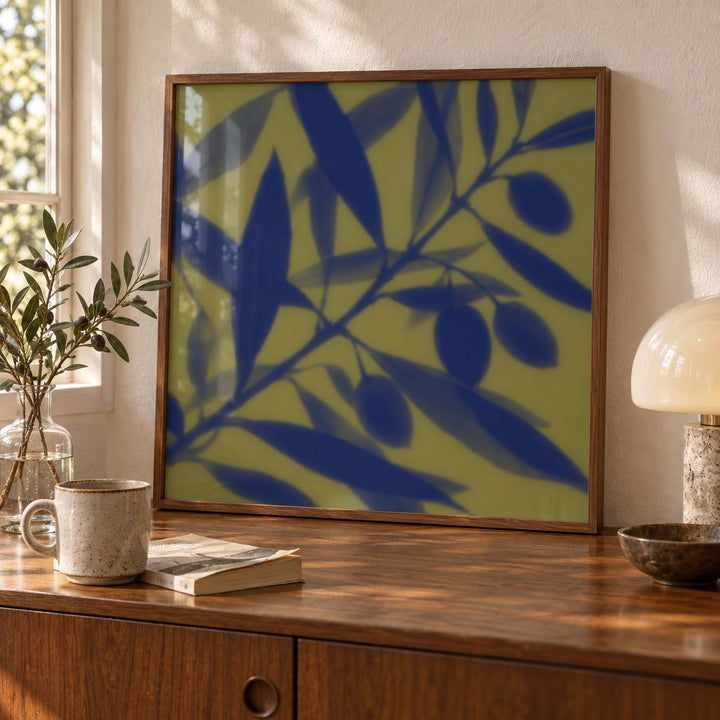 Navy Olive Branch Print shown close up on a sideboard (frame not included)