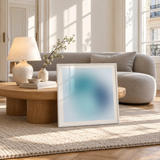 Navy Wall Art, framed and leaning against a coffee table in a bright living room
