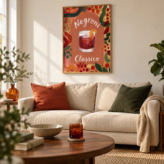 Negroni Art Print, framed on the wall of a relaxed design-led living room in a UK first home with warm white walls and a walnut coffee table