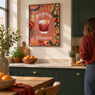 Negroni Art Print, framed on the wall of a welcoming contemporary kitchen in a UK flat with dark green cabinets