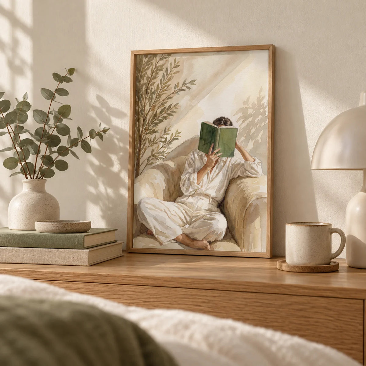Neutral Woman Reading Art Print, a small A4 framed print leaning on an oak bedside shelf