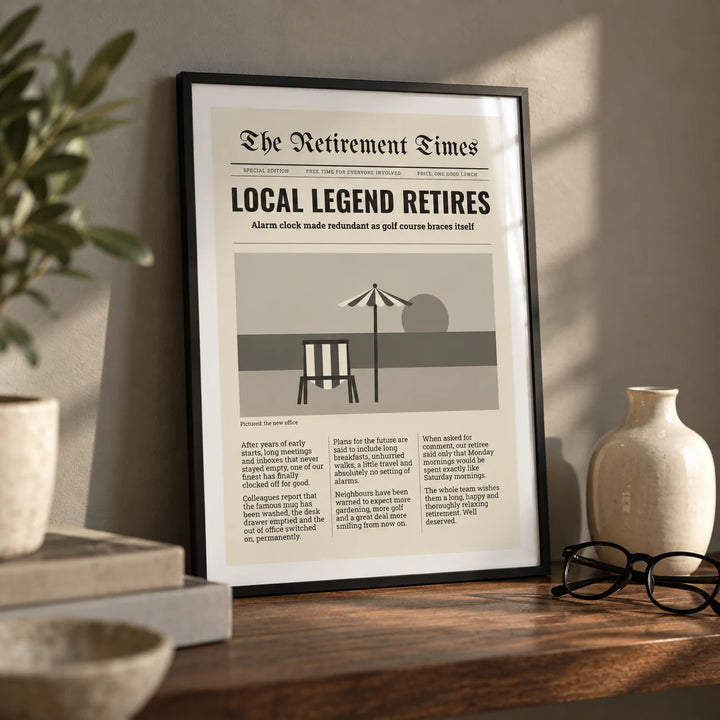 Newspaper Print, a small A4 framed print leaning on a walnut shelf in a living room