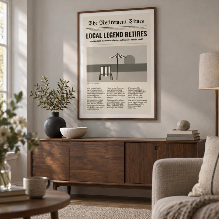 Newspaper Print, framed on the wall of a thoughtfully furnished living room in a retired couple's UK home with a pale grey wall