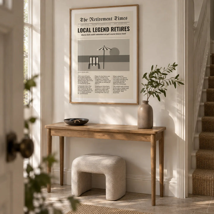 Newspaper Print, framed on the wall of a welcoming hallway in a renovated UK semi-detached home with a soft white wall and plain stone floor