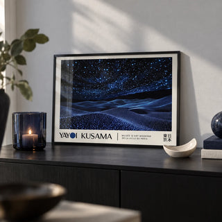 Night Sky Wall Art, a small A4 framed print leaning on a black sideboard in a living room