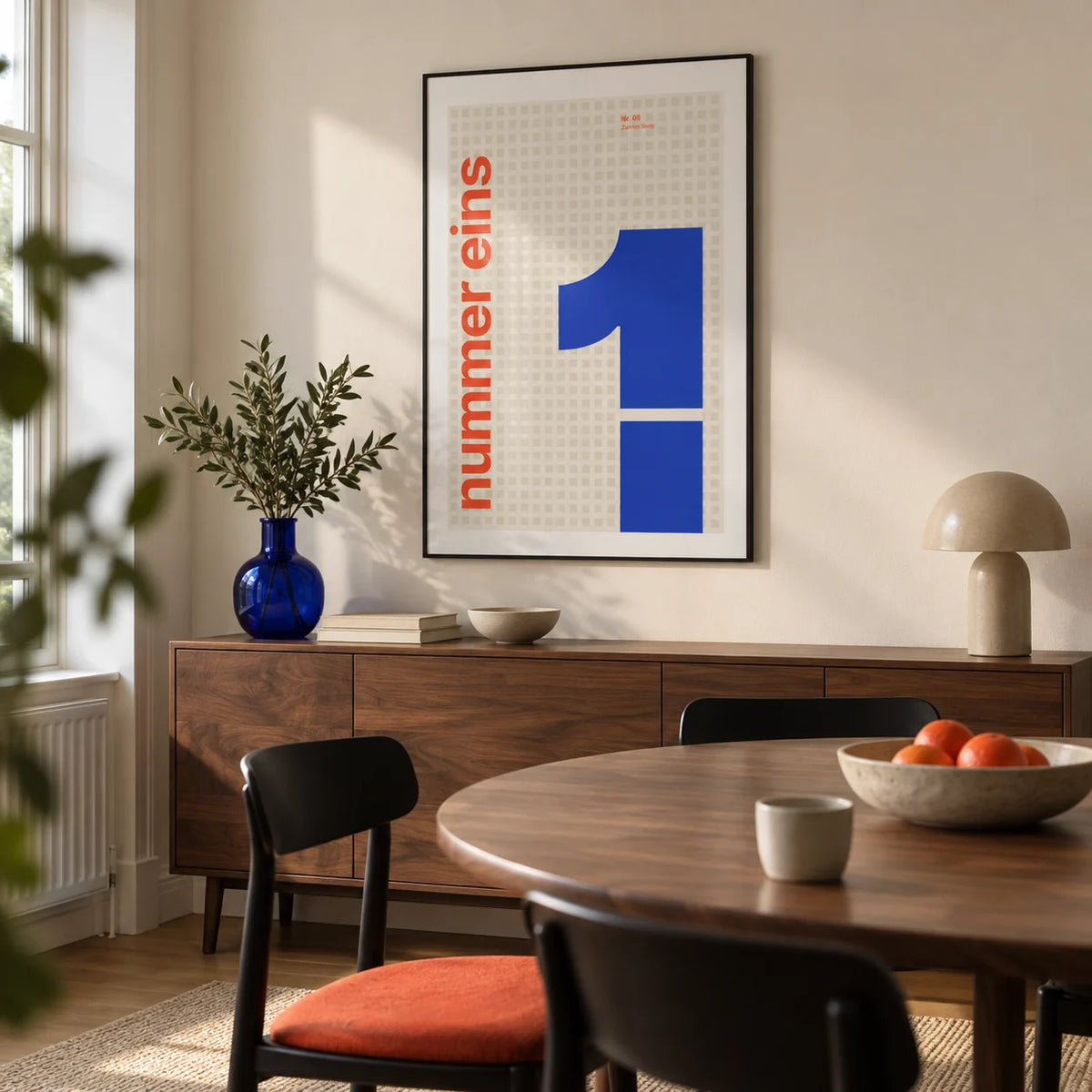 Number 1 Print, framed on the wall of a modern dining room in a renovated UK terrace with a pale cream wall