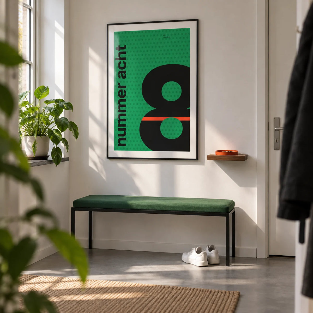 Number 8 Print, framed on the wall of a bright entrance hallway in a young professional's first flat (22-30) with white walls and a smooth grey floor