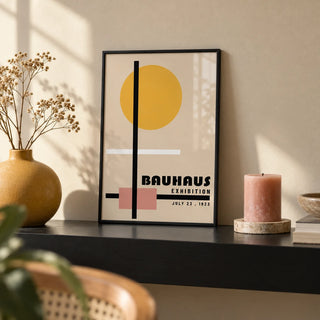 Office Prints, a small A4 framed print leaning on a black shelf in a living room
