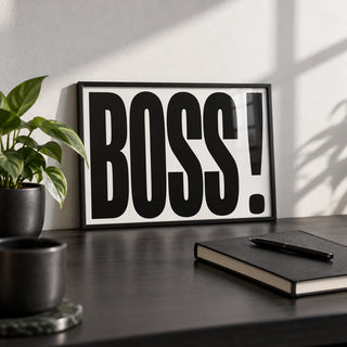 Office Wall Art, a small A4 framed print leaning on a black desk