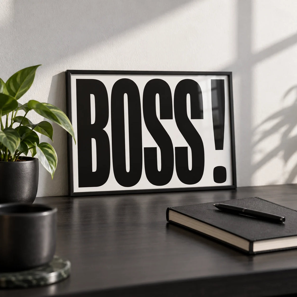 Office Wall Art, a small A4 framed print leaning on a black desk