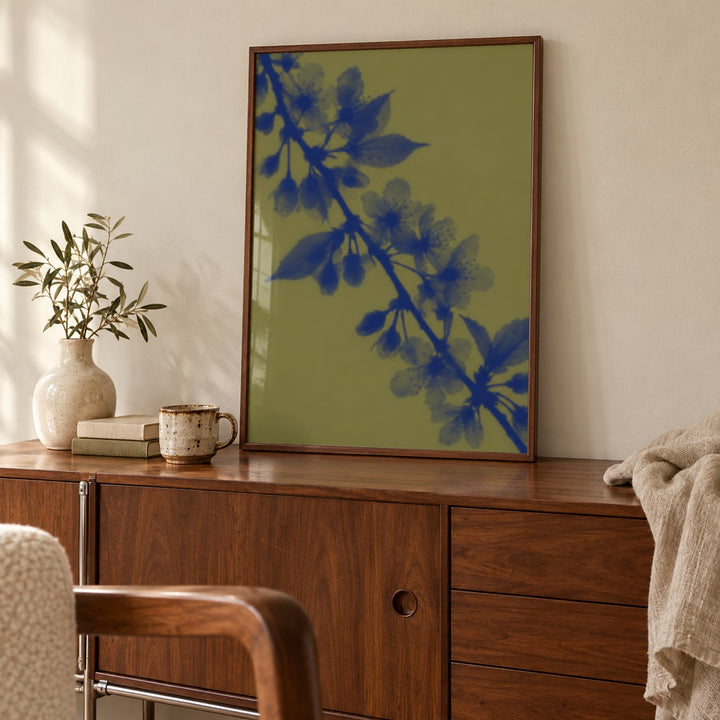 Olive Cherry Blossom Print shown close up on a sideboard (frame not included)