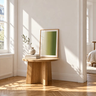 Olive Green Abstract Wall Art, a small A4 framed print leaning on a small solid oak side table