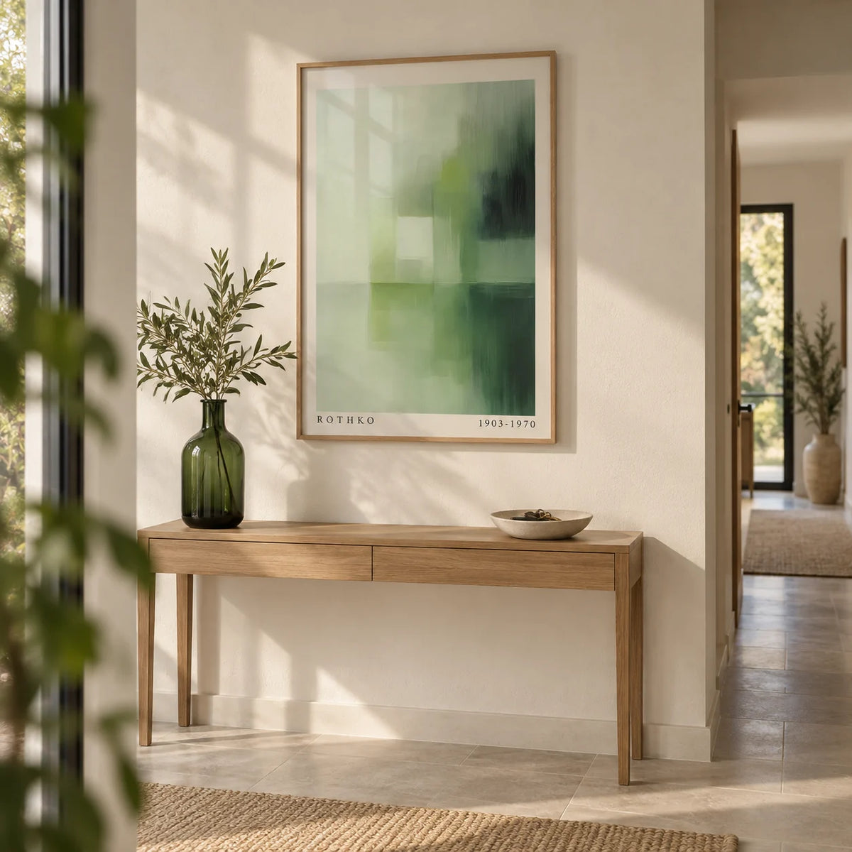 Olive Green Wall Art, framed on the wall of a calm hallway with a warm white wall and a pale stone floor