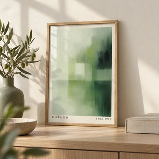Olive Green Wall Art, a small A4 framed print leaning on a pale oak shelf in a living room