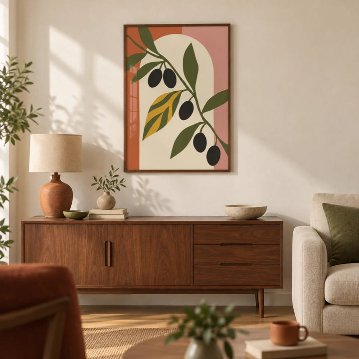 Olive Leaf Print, framed on the wall of a warm mid-century living room in a UK flat with a cream wall and oak floor