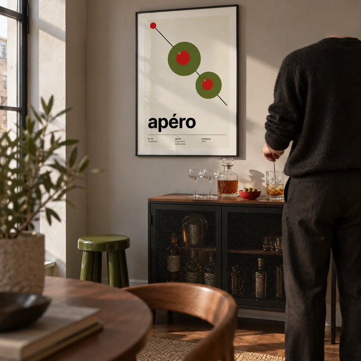 Olive Print, framed on the wall of a compact home bar corner in a design-led UK flat with a warm grey wall in a living room