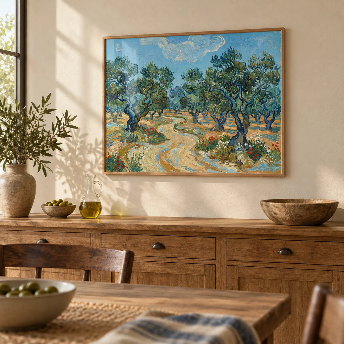 Olive Tree Landscape Print, framed on the wall of a rustic dining room with a warm cream wall