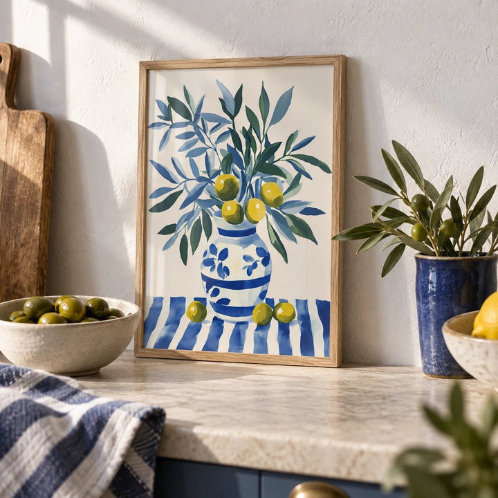 Olive Tree Wall Art, a small A4 framed print leaning on a worktop in a kitchen