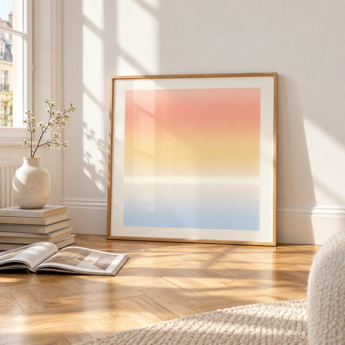 Ombre Print, framed and leaning on the parquet floor of a bright living room