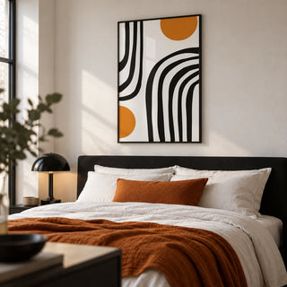 Orange and Black Wall Art, framed on the wall of a calm modern bedroom with a soft white wall