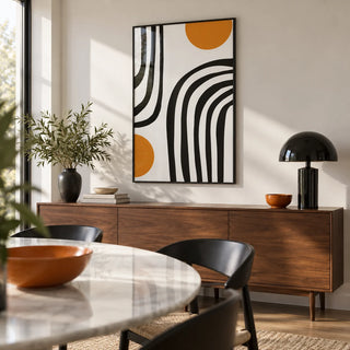 Orange and Black Wall Art, framed on the wall of a modern dining room with a white wall