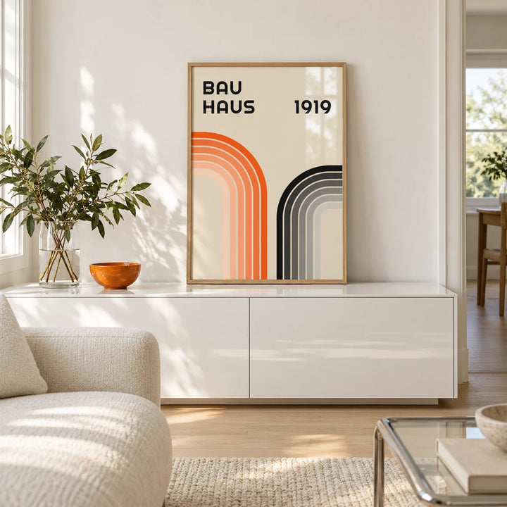 Orange and Black Wall Art, a small A4 framed print leaning on a low pale wooden side table in a hallway