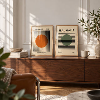 Orange and Green Wall Art Set of 2 styled as small A4 prints on a shelf, to show the gift size: Striped Sun and Modern Orb shown framed side by side (frames not included)