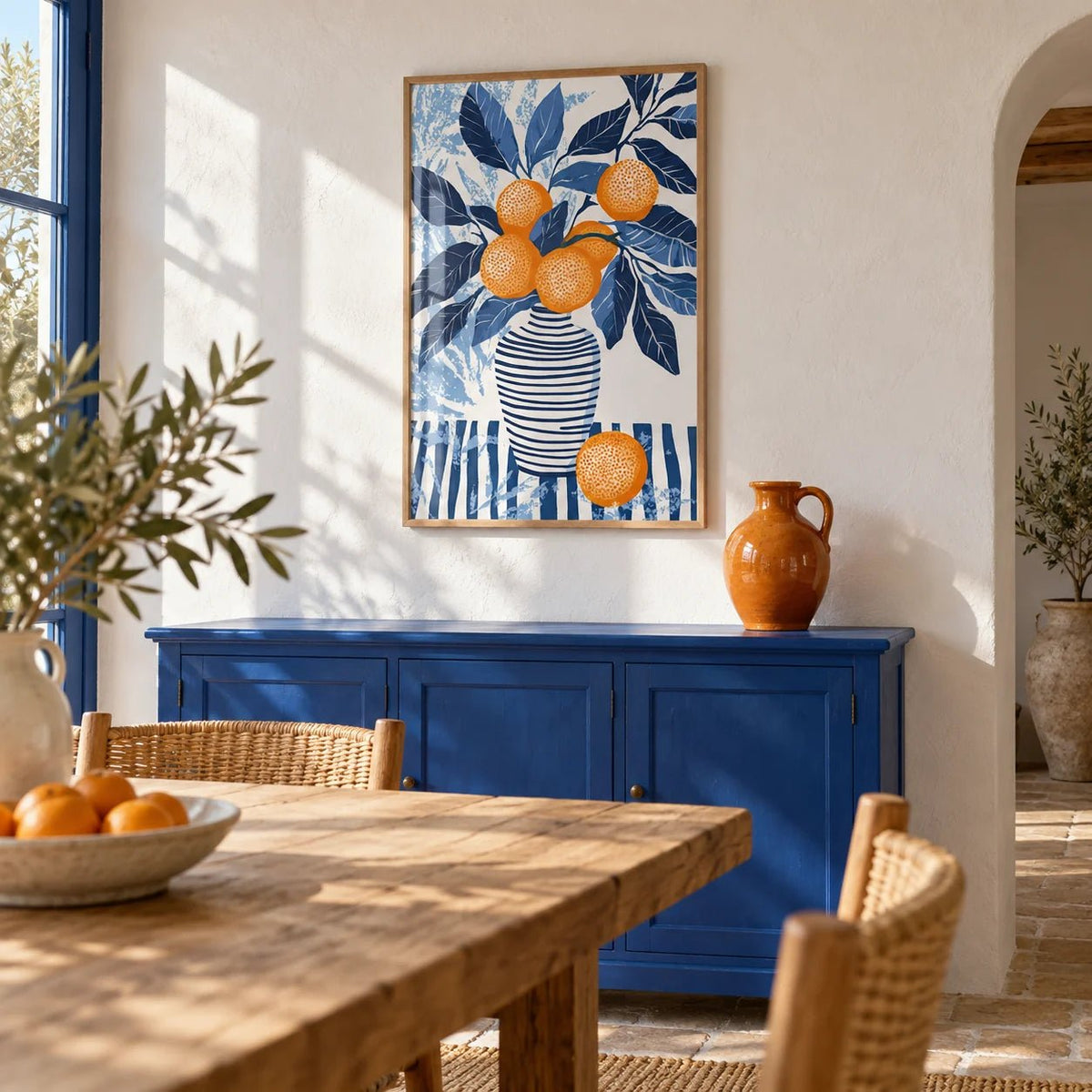 Orange Blue Wall Art, framed on the wall of a sunny Mediterranean dining room