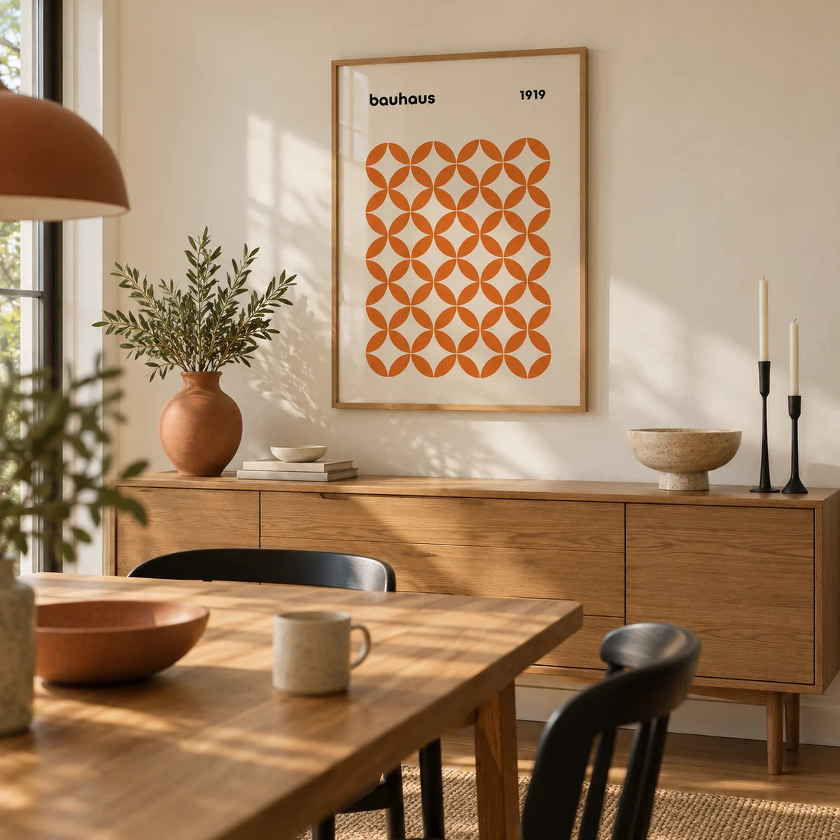 Orange Minimalist Print, framed on the wall of a warm dining room with a cream wall