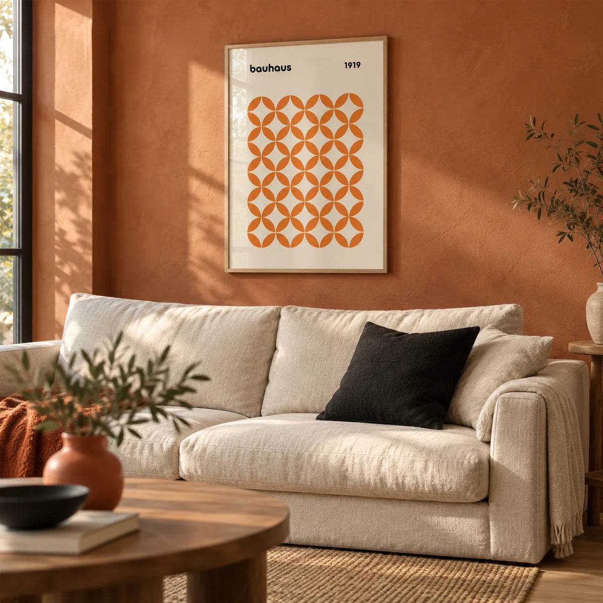 Orange Minimalist Print, framed on the wall of a warm living room with a plain terracotta limewashed wall