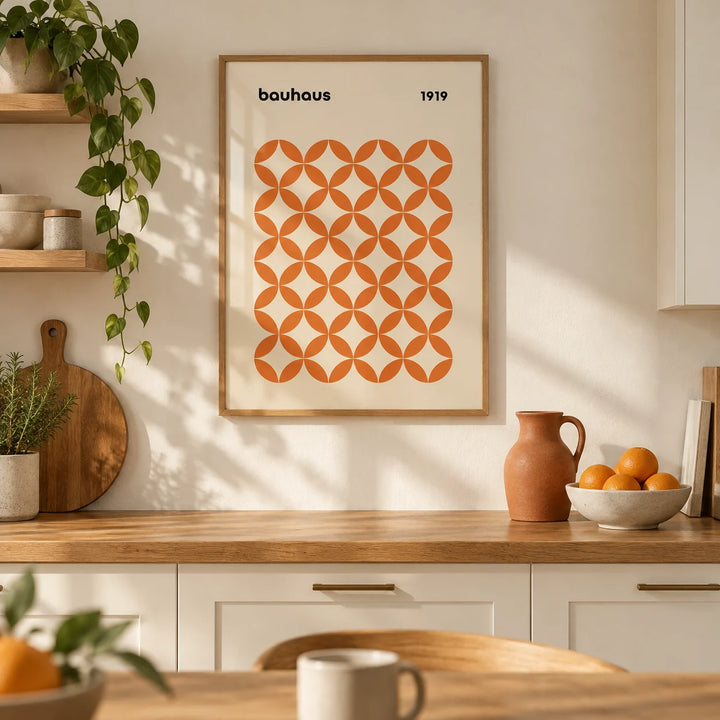 Orange Minimalist Print, framed on the wall of a warm modern kitchen with cream units and an oak worktop