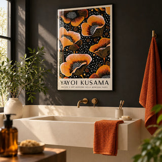 Orange Print, framed on the wall of a modern bathroom with a charcoal black wall and plain cream tiles