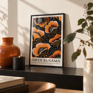 Orange Print, a small A4 framed print leaning on a black shelf in a living room
