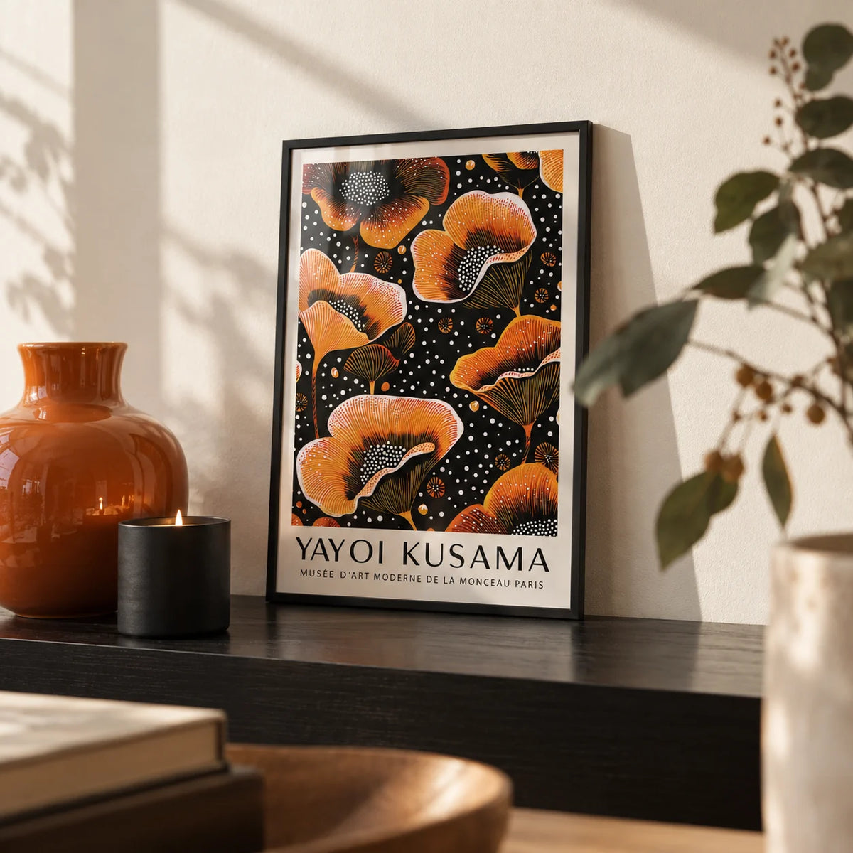 Orange Print, a small A4 framed print leaning on a black shelf in a living room