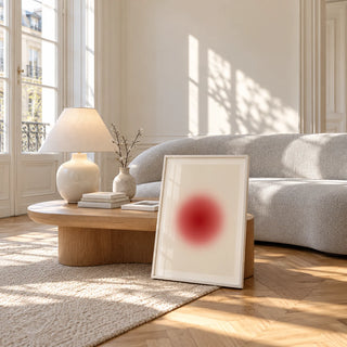 Orb Print, framed and leaning against a coffee table in a bright living room