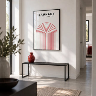 Original Bauhaus Poster, framed on the wall of a crisp white hallway in a modern flat with a pale grey floor
