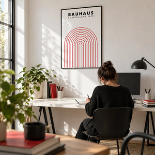 Original Bauhaus Poster, framed on the wall of a graphic designer's home studio with a white wall in a home office