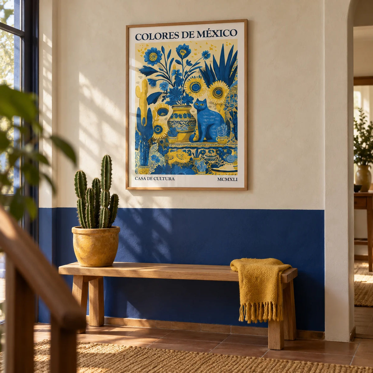 Otomi Wall Art, framed on the wall of a hallway with a plain cobalt blue lower wall and limewashed cream plaster above