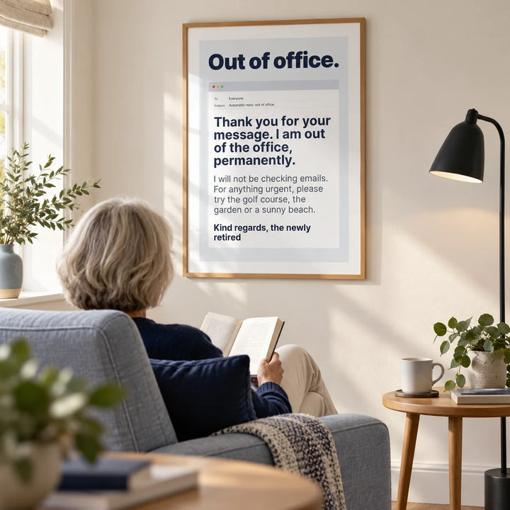Out of Office Print, framed on the wall of a crisp contemporary living room in a retired couple's UK home with a warm white wall