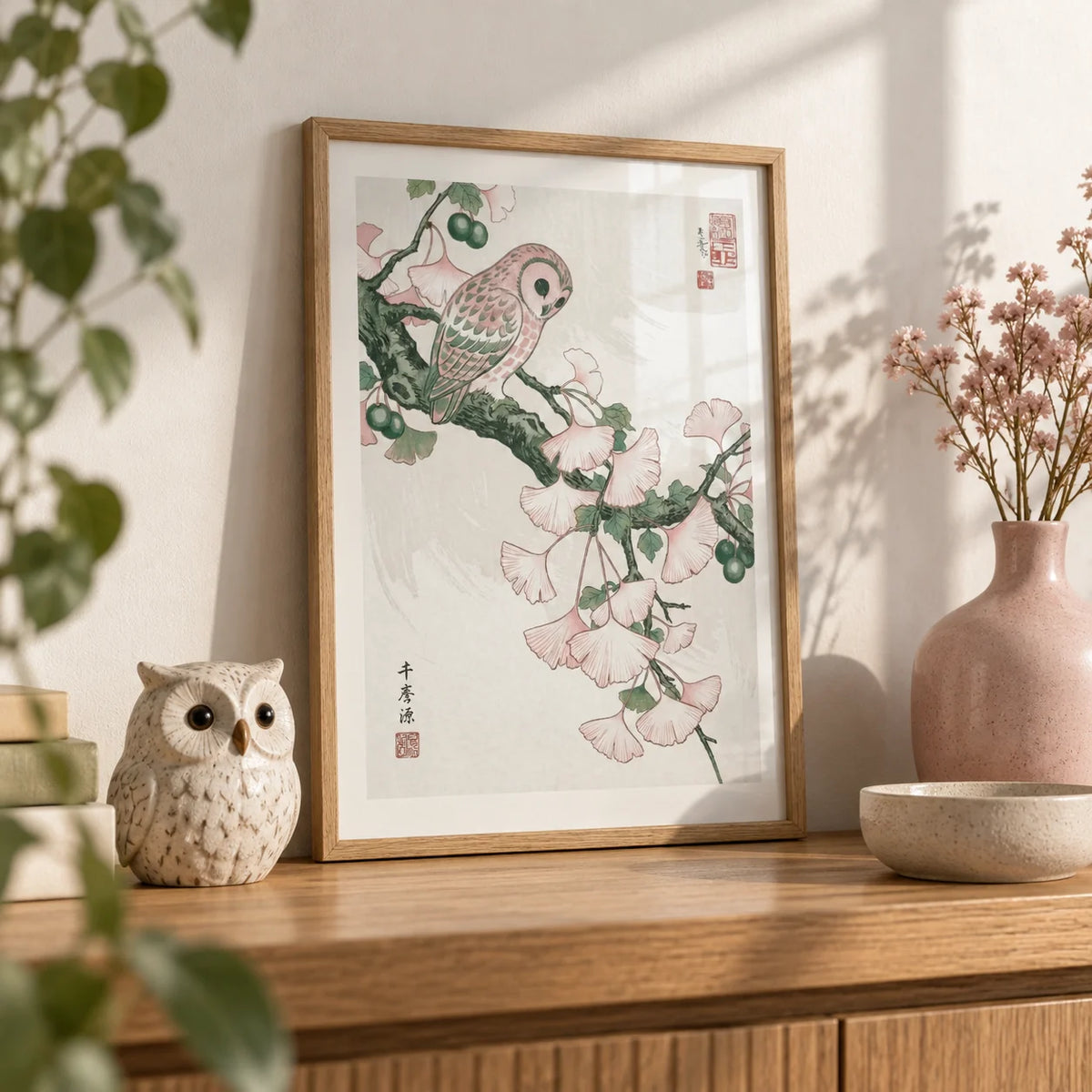 Owl Art Print, a small A4 framed print leaning on an oak shelf in a living room