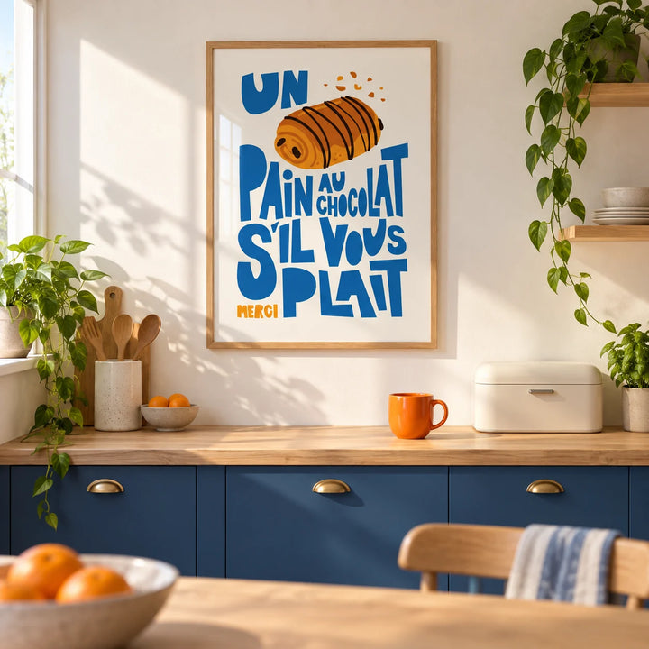 Pain Au Chocolat Print, framed on the wall of a bright modern kitchen in a UK first flat (22-28) with warm white walls