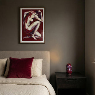 Bedroom with a painting of a nude figure on the wall above a bed.