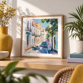 Paintings of Cuba, a small A4 framed print leaning on an oak shelf in a living room